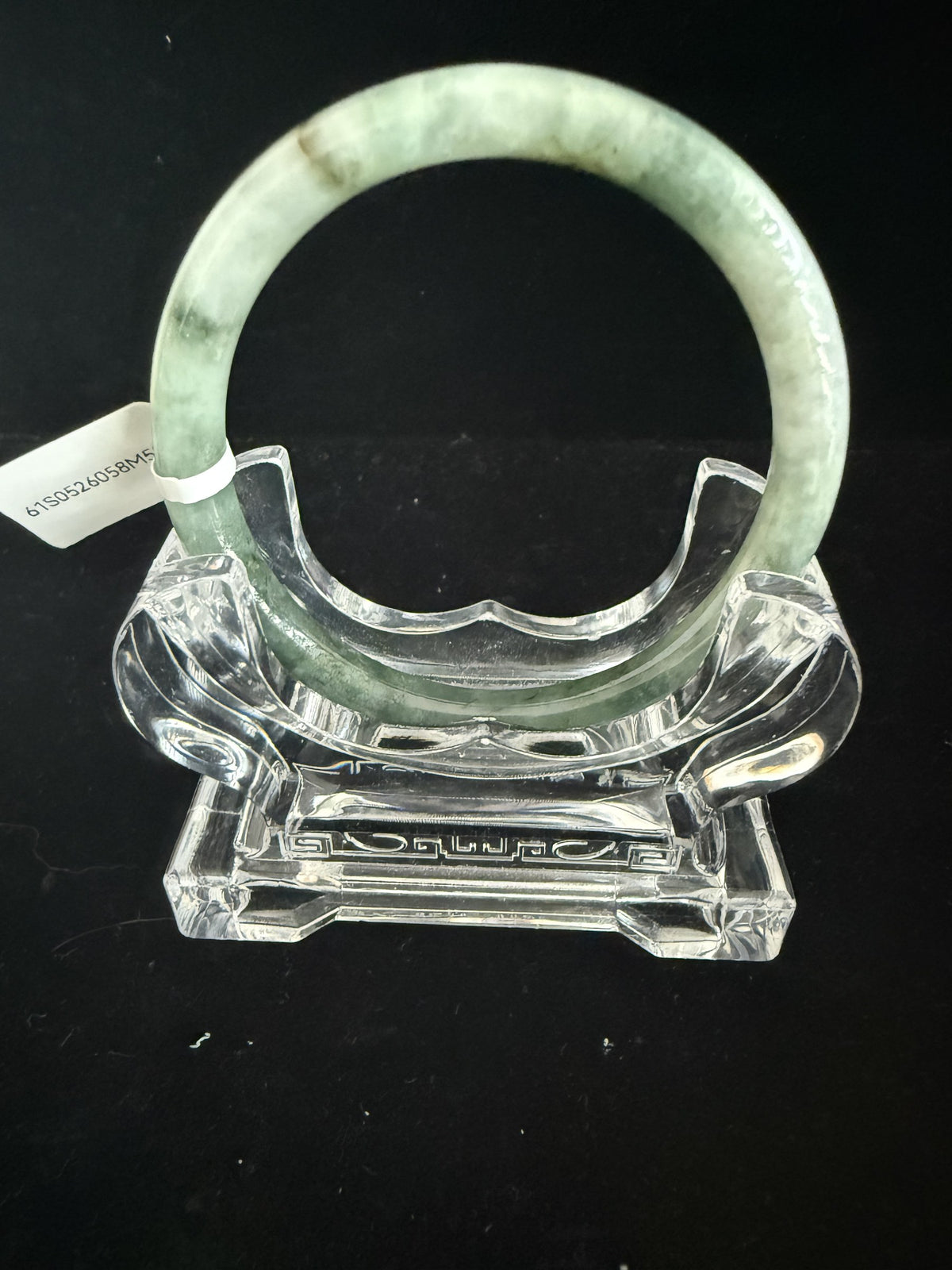 520. Grey-green mottled thin jade bangle