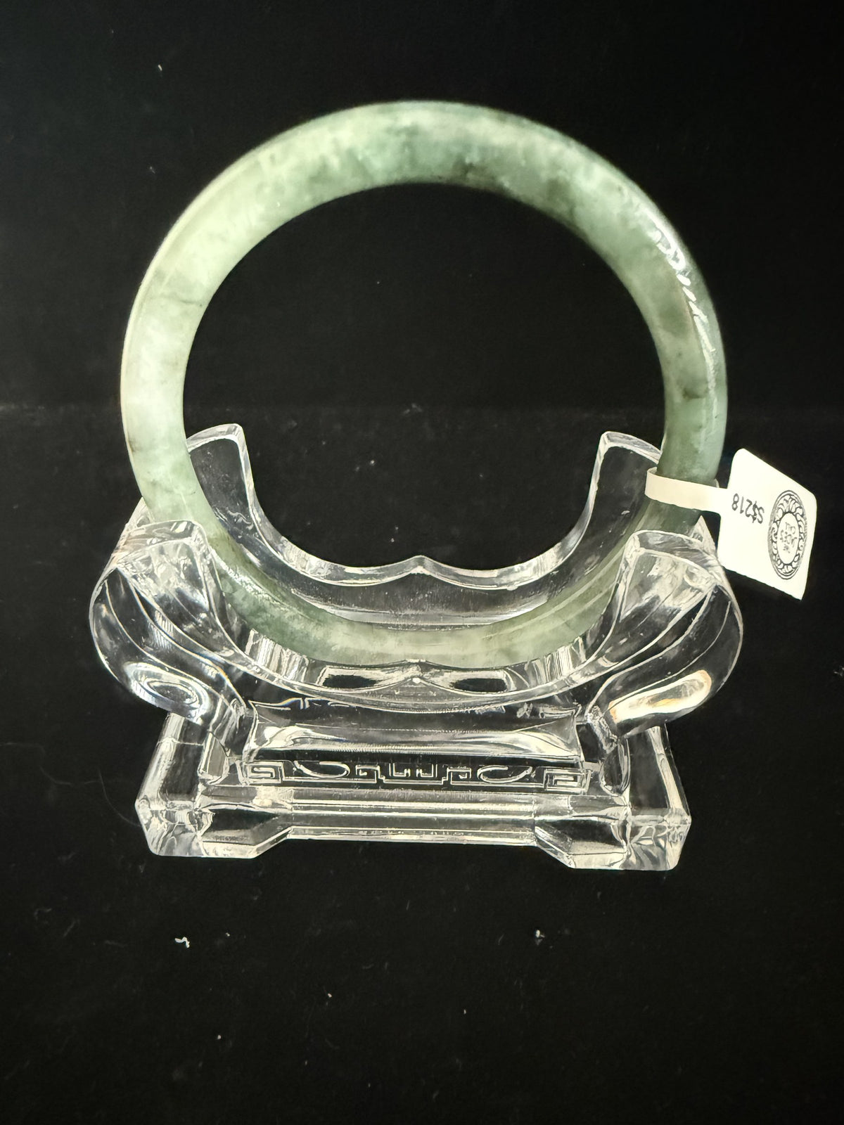 520. Grey-green mottled thin jade bangle