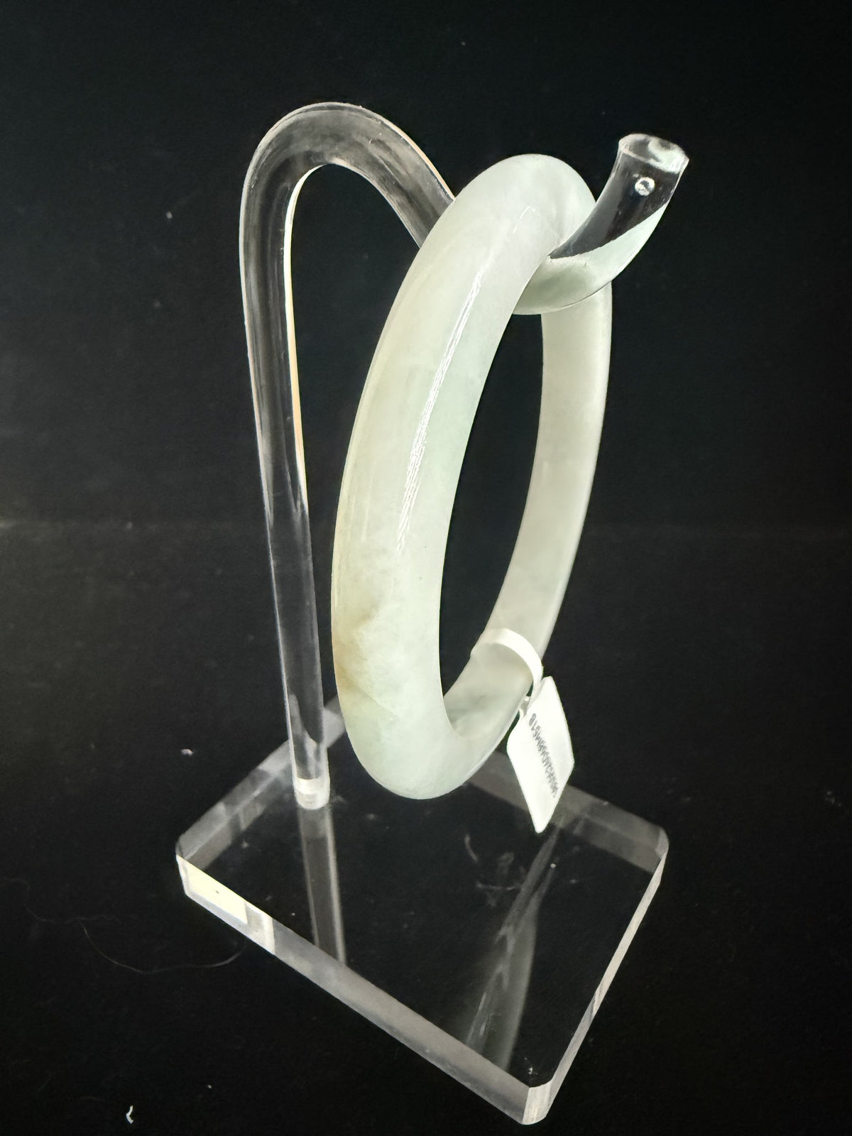518. Pale celadon with olive green patch jade bangle