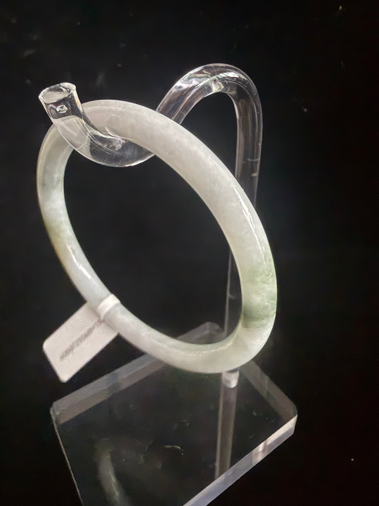 186. Thin white with dashes of green Jade bangle