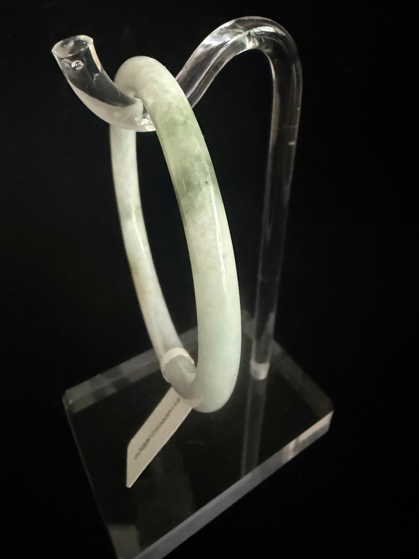 186. Thin white with dashes of green Jade bangle