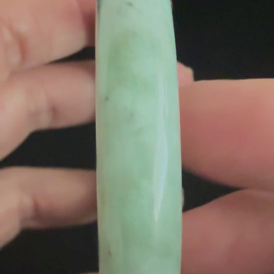 485. Deep grey-green mottled jade bangle video